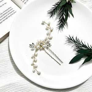 Pearl and rhinestone hair pin with silver floral barrette