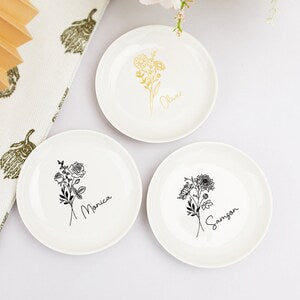 Set of 3 round white ring dishes with black birth-flower line art