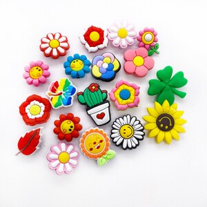 Colorful floral and cute face croc charm set with flower-shaped Jibbitz for clogs