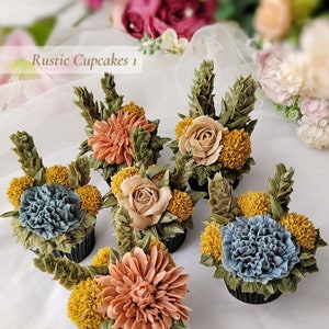 Rustic cupcakes topped with assorted buttercream flowers and green leaves