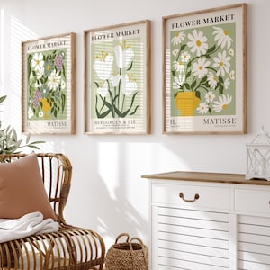 Set of three framed flower market prints in green and white with daisy florals