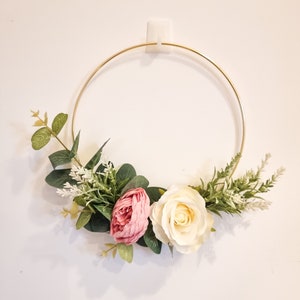 Floral hoop headband with cream rose, pink rose, and green foliage