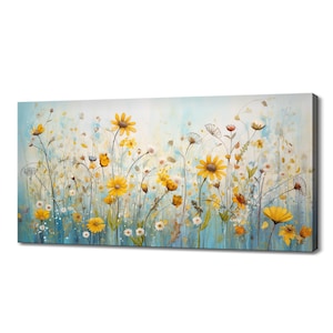 Watercolor wildflower canvas wall art with yellow daisies and soft white blooms on blue