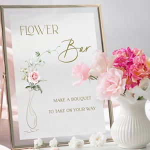 Framed flower bar sign with 'Flower Bar' text and small floral accents on white board