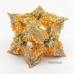 Beaded cube ornament with orange, teal, and cream beadwork