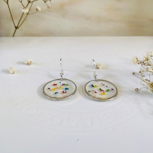 Round resin confetti drop earrings with multicolored flecks and silver hooks