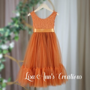 Orange sleeveless flower girl dress with lace bodice and tulle skirt