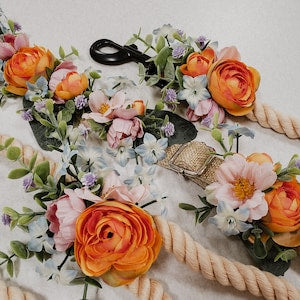 Floral dog collar with orange and pink faux flowers on braided rope strap