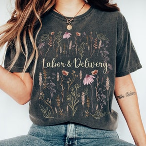 Dark gray short-sleeve nurse shirt with floral 'Labor & Delivery' print