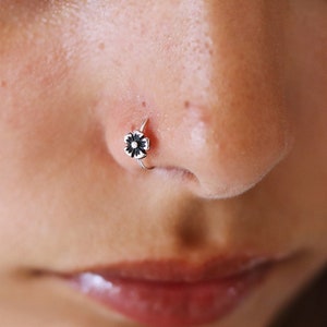 Rose gold flower nose hoop with small dangling stud detail