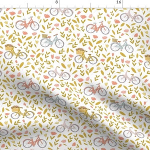 Cotton fabric yardage with small bicycles and green leaf pink flower print on white
