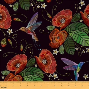 Botanical bird print fabric by the yard with red flowers, green leaves, and hummingbirds