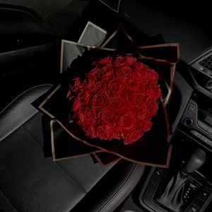 Red handmade artificial rose bouquet in gift box with satin ribbon