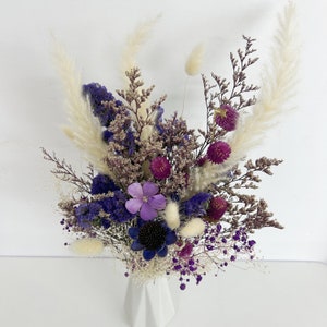 Dried flower bouquet with purple blooms and cream pampas plumes