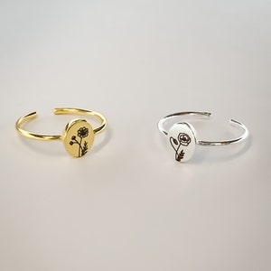 Minimalist signet ring set, gold and silver, with circular engraved medallion tops