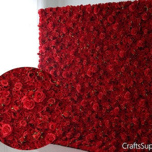 Red artificial rose flower wall panel with dense blooms and curled edge