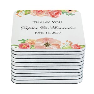 Stack of thank you wedding favor magnets with floral design and date text