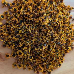 Bundle of dried coreopsis flowers with yellow blooms and dark centers