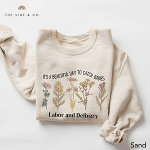 Cream crewneck sweatshirt with floral graphic and Labor and Delivery print
