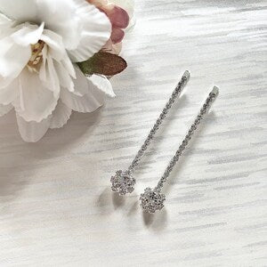 Set of 2 silver rhinestone hair clips with glittery flower centers