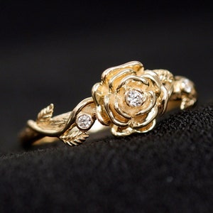 14K solid gold rose flower ring with diamond-like stones and leaf accents