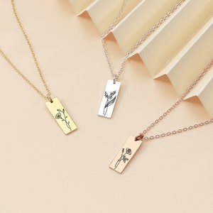 Birth flower engraved pendant necklace with rectangular floral charm, gold-tone and silver-tone