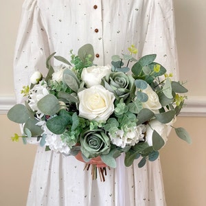 White and sage rose bouquet with eucalyptus greenery and ribbon wrap