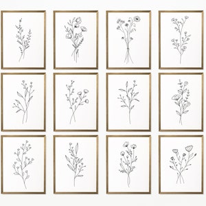 Set of 12 minimalist black-and-white botanical line art prints, framed wildflower bouquets