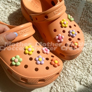 Pastel flower shoe charms set of 10, multicolor flower pieces on light orange clogs