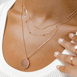 Rose gold flower of life pendant necklace with layered chain and round disc charm