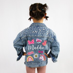 Kids denim jacket with rhinestone bow and 'Maddie' graphic on back