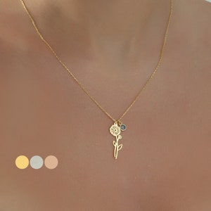 Gold birth flower birthstone necklace with small round charm and dangling flower pendant