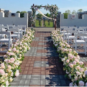 Champagne and pale pink corner aisle floral swag garland with terracotta accents