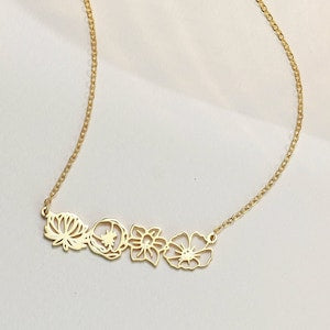 Gold-tone necklace with small floral charm pendants and link chain