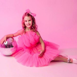 Hot pink tulle tutu party dress with bow at neckline and layered skirt