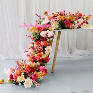 Dusty pink and cream artificial floral runner with mixed blossoms and greenery