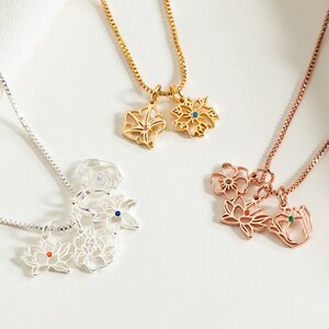 Birth flower pendant necklaces set in gold, rose gold, and silver with small gemstones