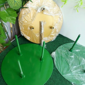 Large green metal flower stand base with three upright rods