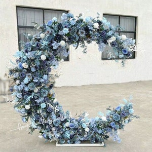 Blue and white crescent floral wreath with voluminous roses and greenery for semi-arch decor