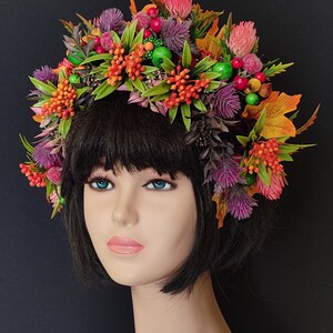 Floral flower crown headpiece with purple, orange blooms and green leaves, pink and red accents