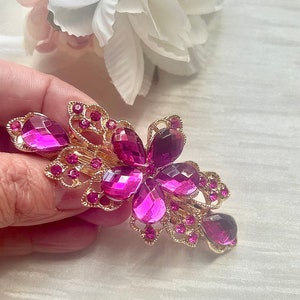 Pink rhinestone floral hair barrette with gold-tone metal and gem accents