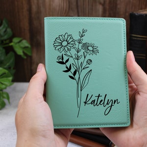 Teal passport holder with line-art birth flower and cursive name Katelyn