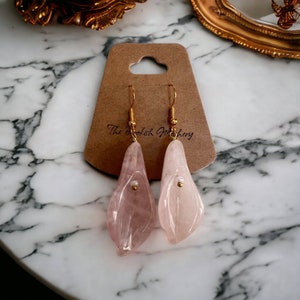 Gold-tone clip-on earrings with pink quartz flower drops