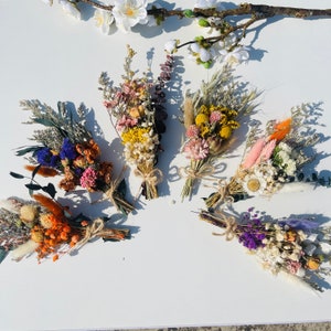 Handmade mini dried flower bouquet with multicolor wildflowers and grasses
