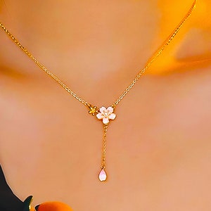 Cherry blossom pendant necklace with pink flower charm and dangling pink teardrop