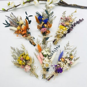 Small dried flower bouquet assortment of mini bundles with orange, purple, and yellow blooms