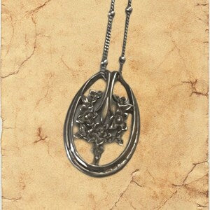Sterling silver 925 oval pendant with engraved tree-like floral design on chain