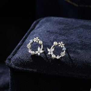 Tiny flower wreath stud earrings with butterfly accents, silver-tone, round CZ centers