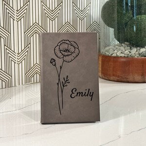 Personalized birth flower journal with line-art flower and custom name Emily on cover