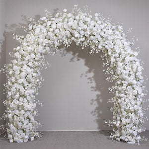 White rose flower arch garland with clustered blooms on a circular wedding backdrop